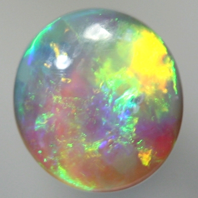 SOLID CRYSTAL OPAL Rolling flashes of orange and green fire 